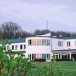 Hotel Juelsminde Strand Fassade in der Abenddämmerung