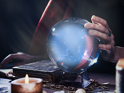 Clairvoyant with a mysterious blue crystal ball